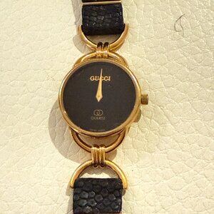 Vintage Gucci 6000L womens swiss quartz watch round case black leather strap
